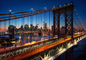 a bridge with a city in the background